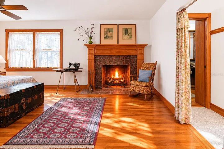 The Primary features its own wood-burning fireplace with stone surround.