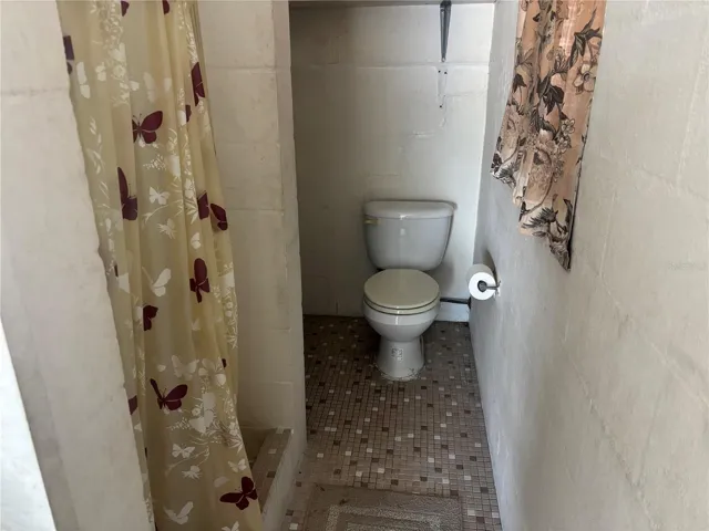 Second Bath in Garage with Shower, Toilet and Utility Sink