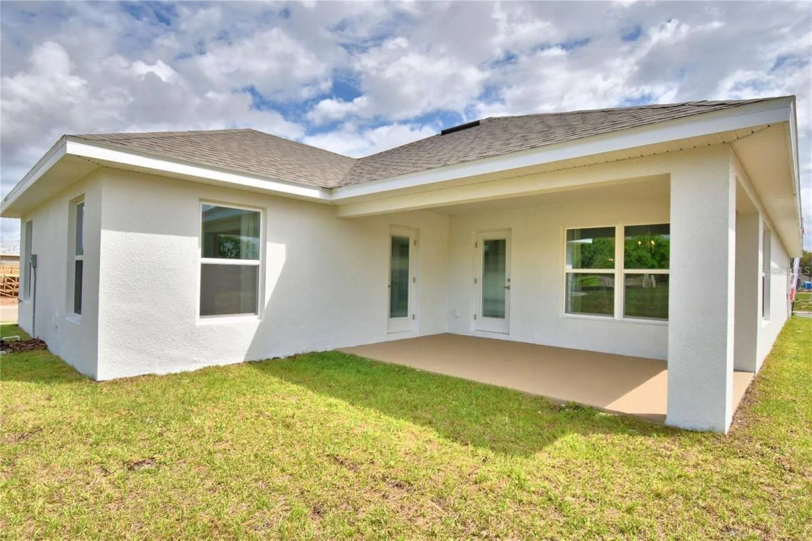 Rear covered porch from similar home, colors and options may vary