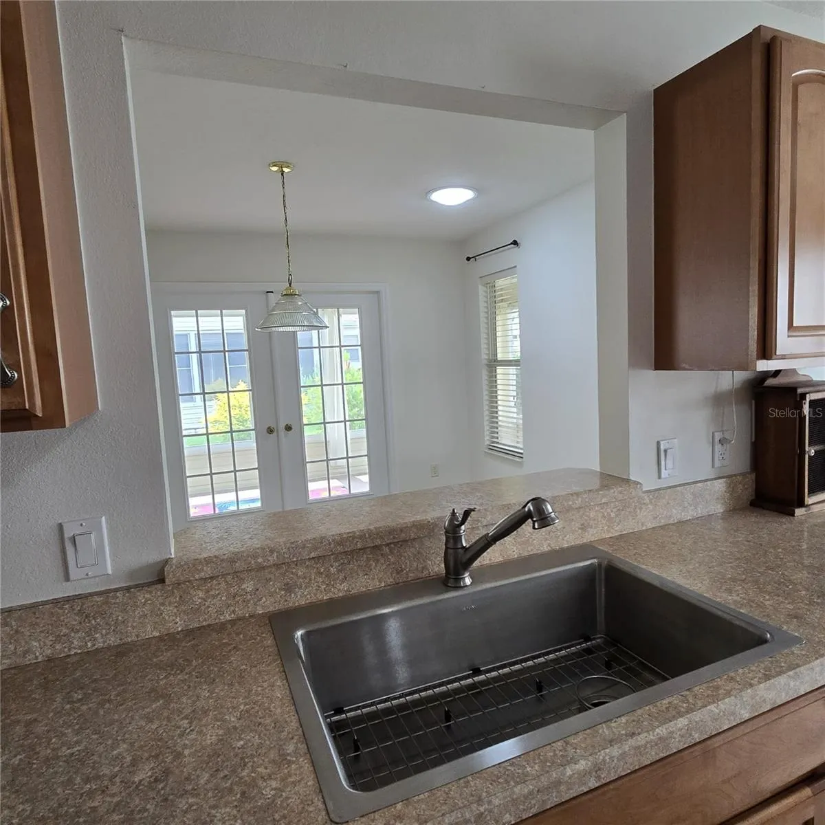 Kitchen w/Pass Through to Dinning Room & Viw of Lanai