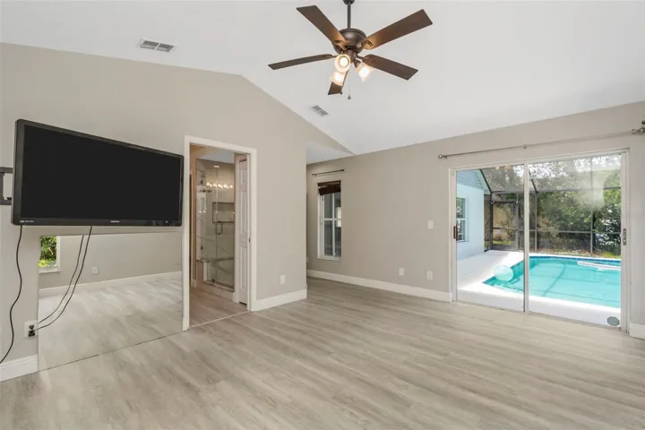 Primary bedroom with gorgeous pool view.