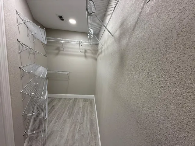 Expanded and Upgraded Walk-in Closet Primary Bedroom