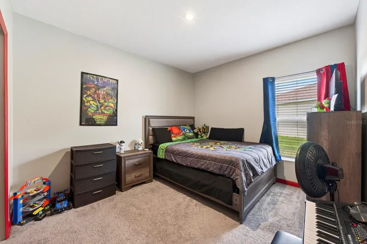 Two additional bedrooms and SECOND FULL BATH are located on the opposite side of the home, offering flexibility for guests, family, or a home office. Bedroom 3