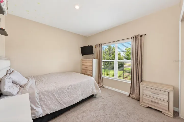 Two additional bedrooms and SECOND FULL BATH are located on the opposite side of the home, offering flexibility for guests, family, or a home office. Bedroom 2