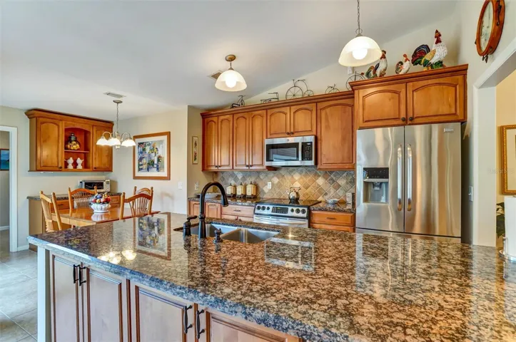 Kitchen features stainless appliances.