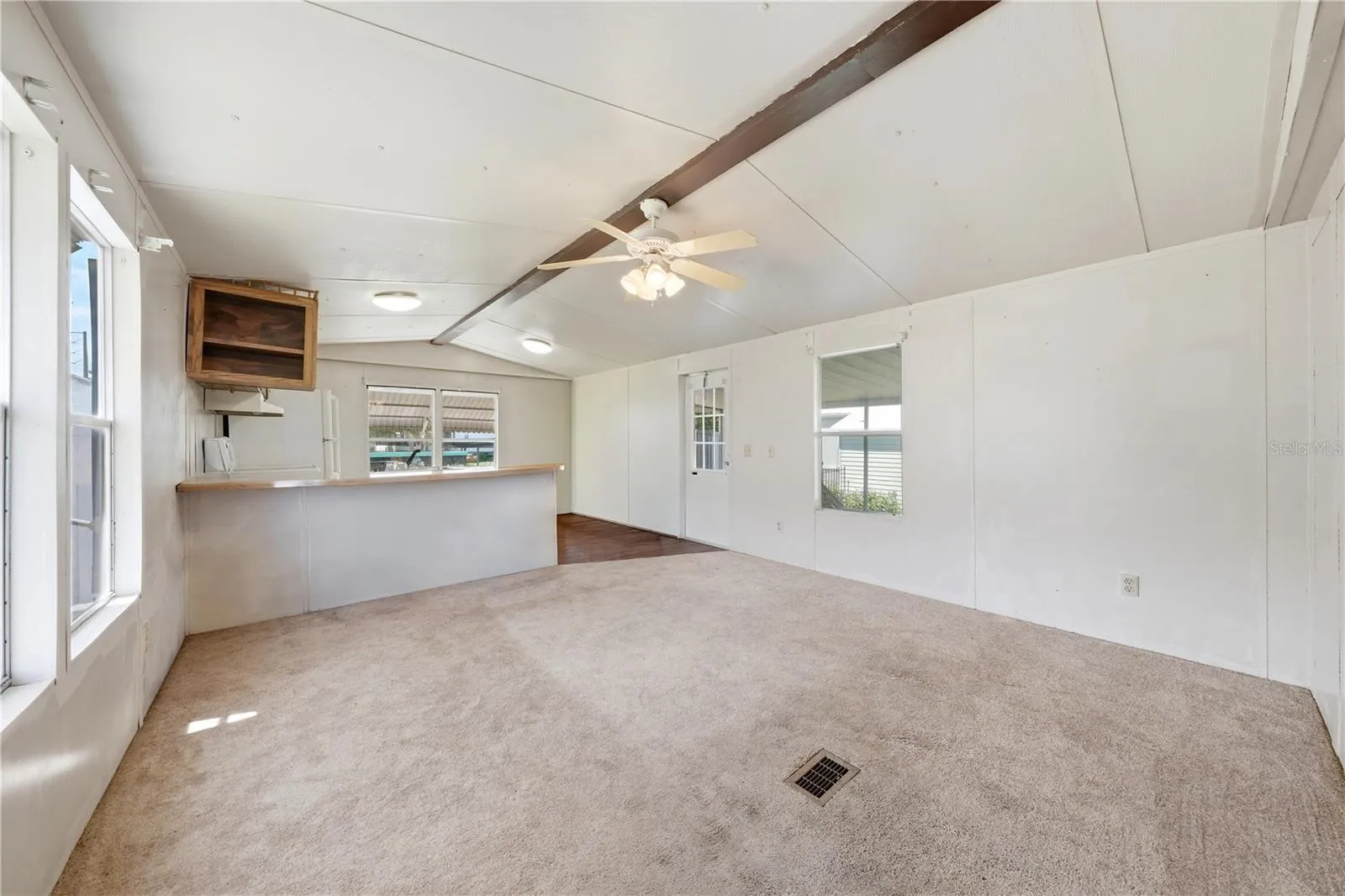 Living room with counter seating at Kitchen counter