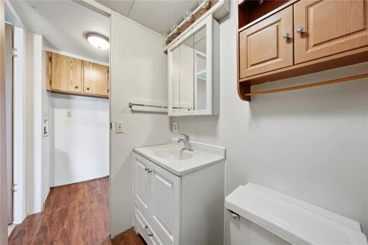 Laundry connections in hallway across from bathroom