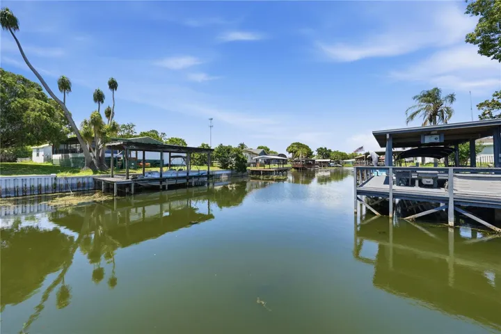Your waterfront oasis awaits - wide canal leads to Lake Dora & Harris Chain of LAkes!