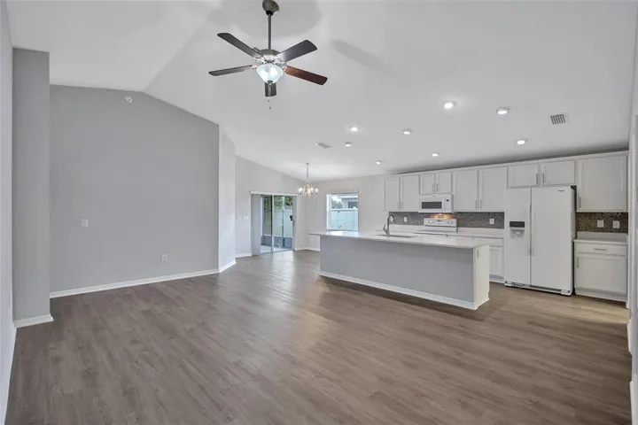 Open-Concept Layout that Seamlessly Connects the Living, Dining, and Kitchen