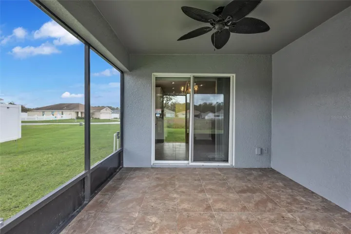 Covered Screened-In Lanai With Tile Flooring