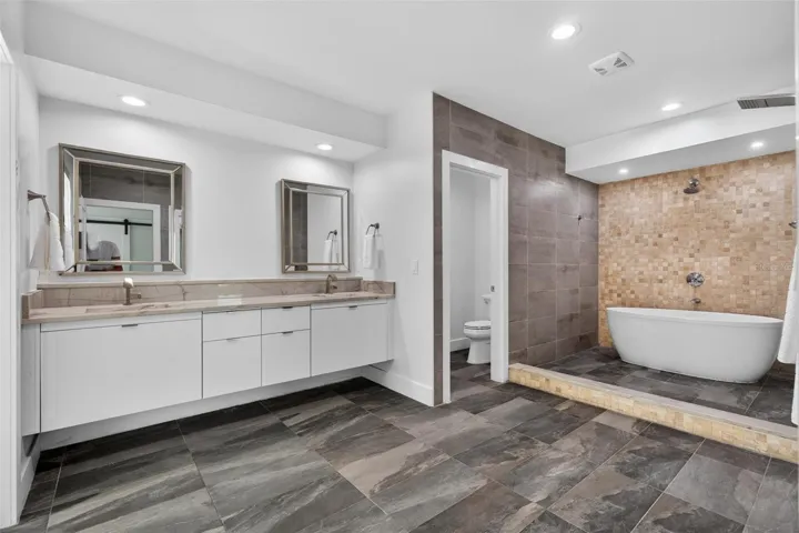 Your HUGE master bathroom with dual sinks, muliple shower heads and large soaking tub.