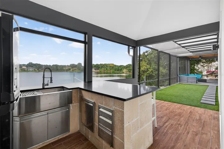 Summer kitchen overlooking water and Putt Putt green.