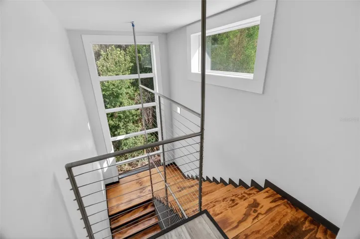 Heading downstairs to the lower level, you'll find an additional 3 bedrooms all with stunning water views and 2 full bathrooms.