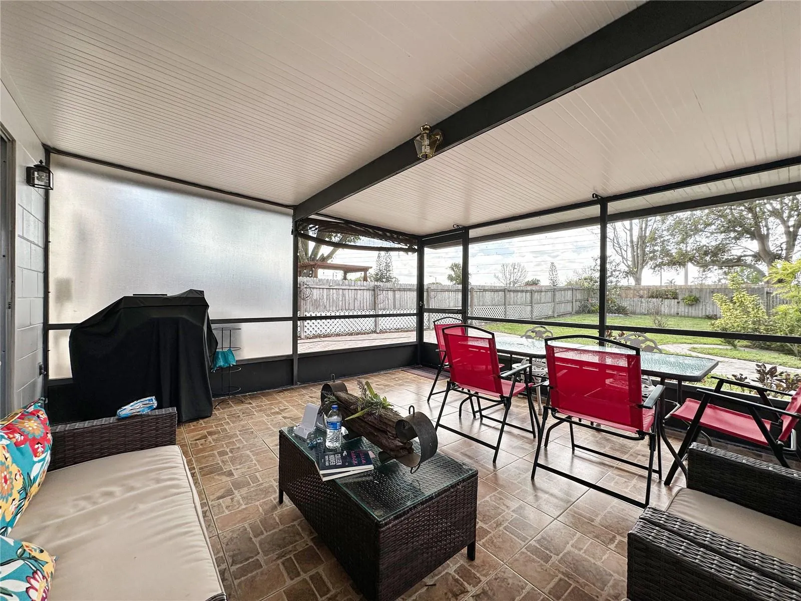 Another view of the porch offers also a view of the fenced patio.