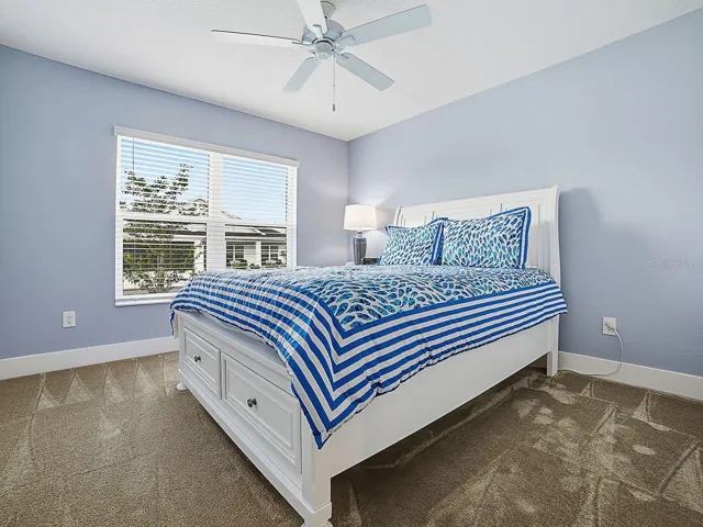 Spacious front guest bedroom.