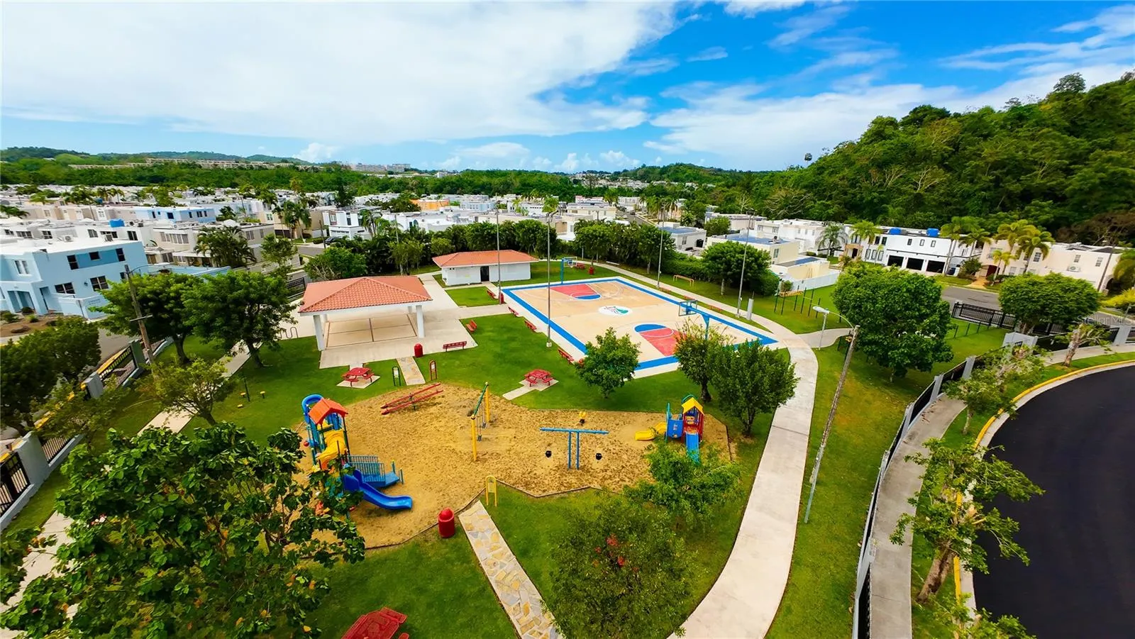 ONE OF MANY RECREATIONAL AREAS: ENTRERIOS PLAYGROUND, GAZEBO AND BASKETBALL COURT