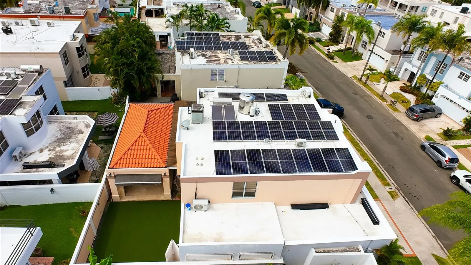 Solar water heater with double panel and 82-gallon tank.  A 450-gallon water cistern, 25 solar panels and 2 Tesla batteries, with an approximate 26K total solar system.