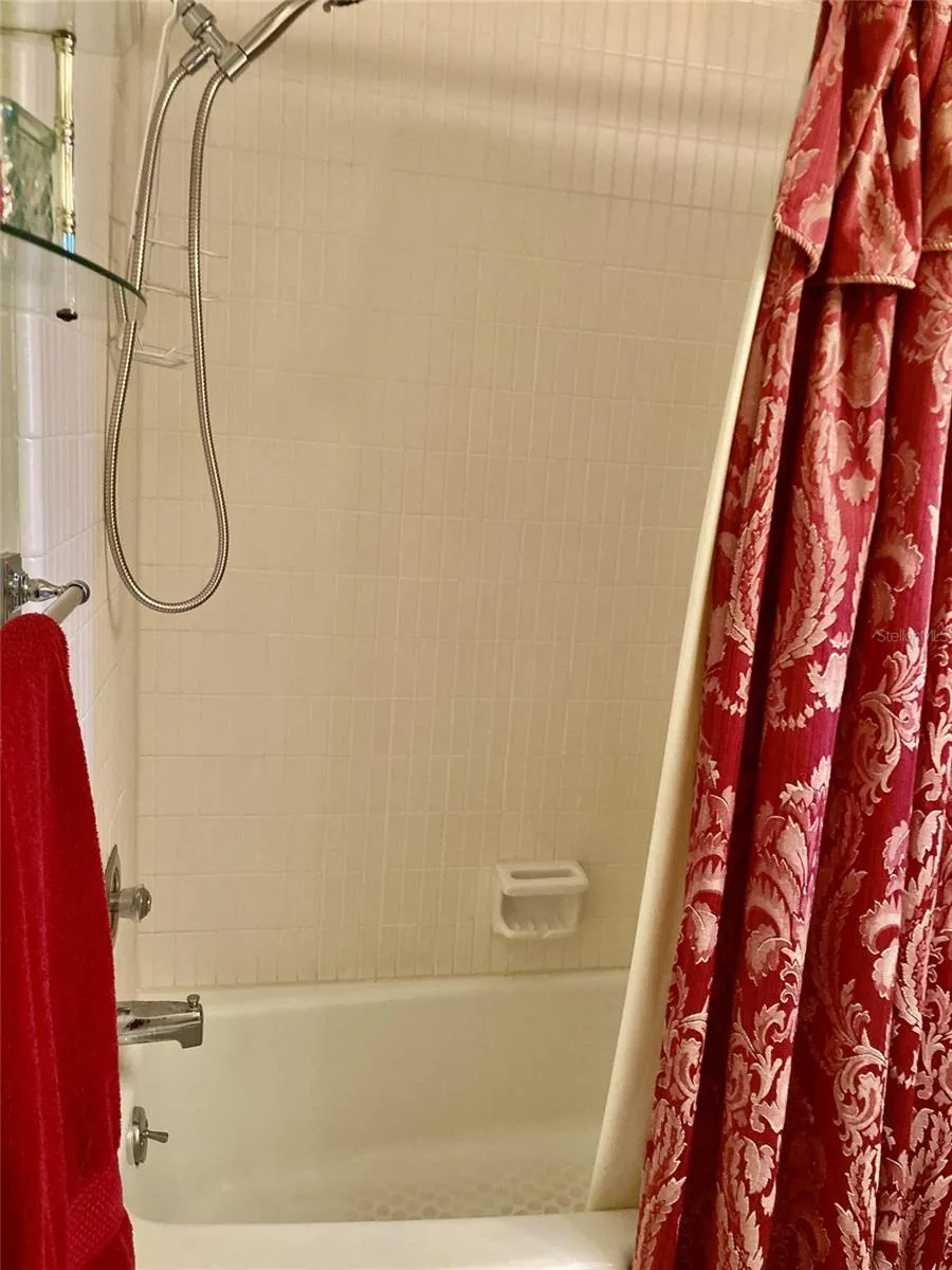 Tub with shower.