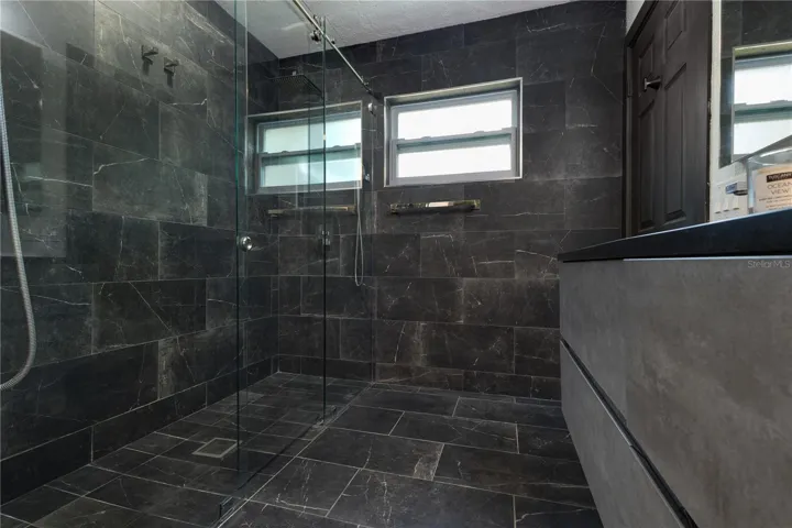 All tile double shower head shower.