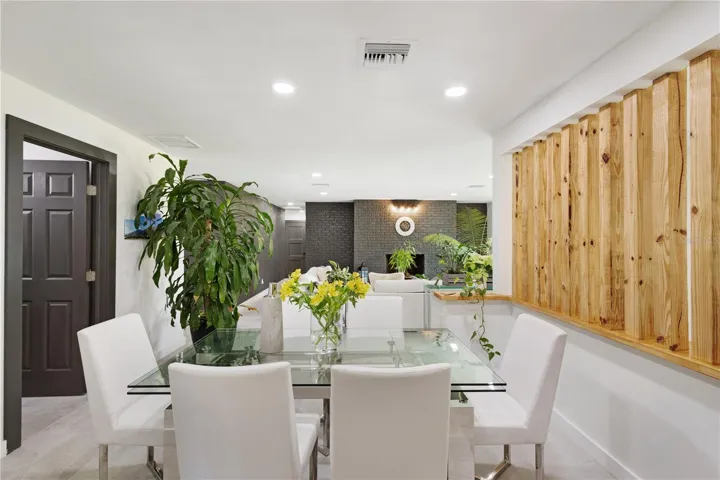 Dining area with door to the half bathroom.
