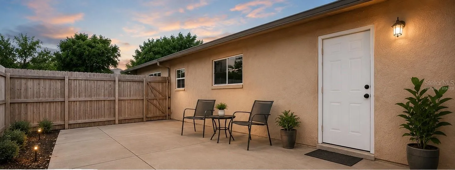 Virtually staged back fenced patio