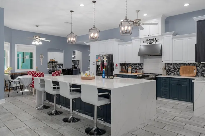 Gorgeous kitchen with quartz countertops and double wide island with waterfall ends.