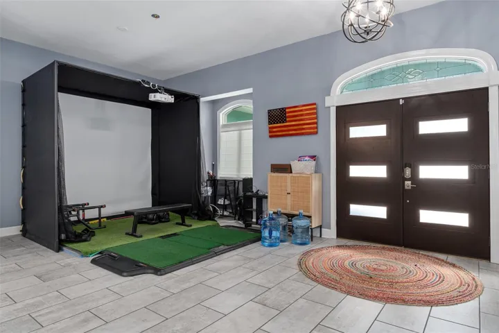 Dining Room - currently used for golf simulator (available for purchase with the home)