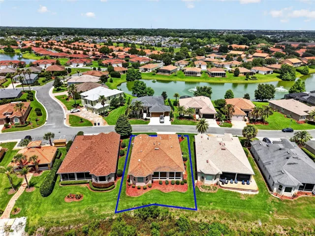 LOOKING BACK TOWARDS THE COMMUNITY WITH PONDS AND FOUNTAINS THROUGHOUT THE AREA.