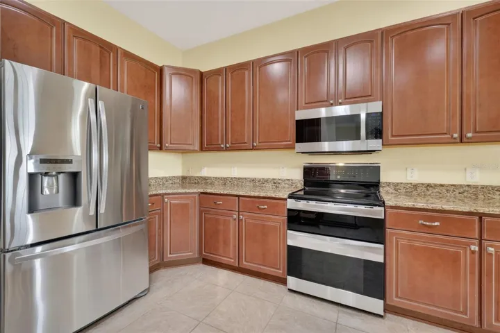 AND FRENCH DOOR REFRIGERATOR. LOT OF CABINETS AND COUNTER SPACE.