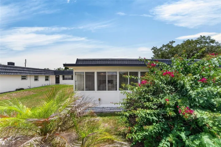 This beautiful hedge separates this home from backyard neighbors