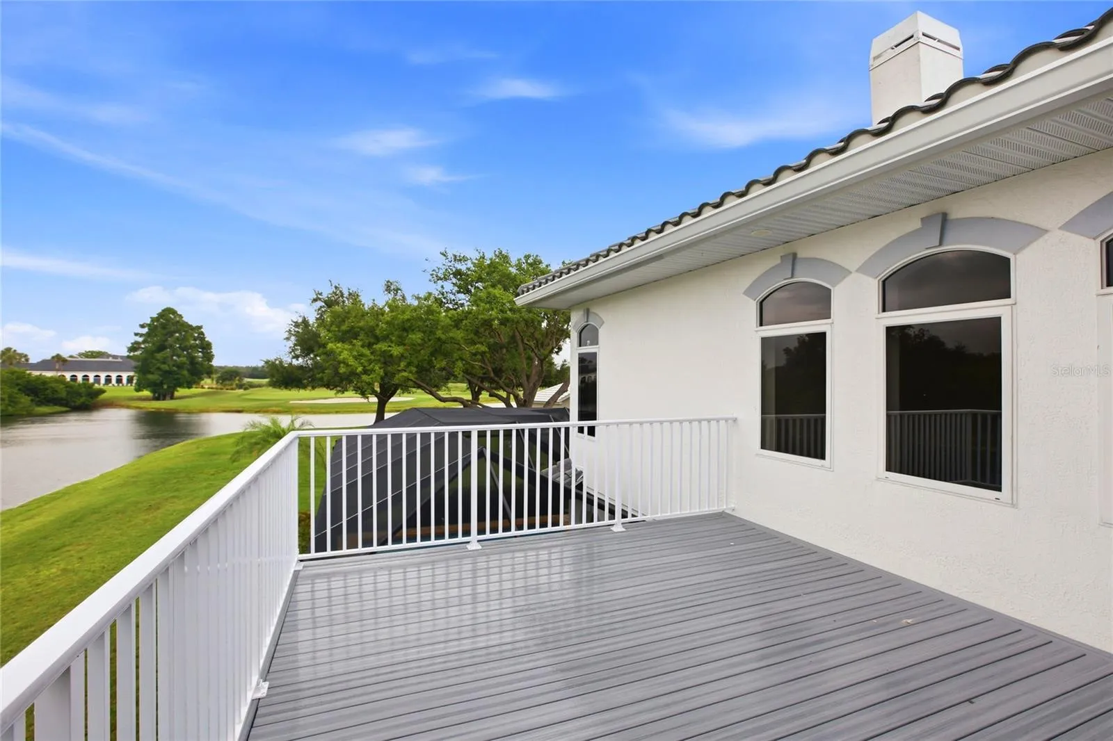 The upstairs balcony overlooks the lake and 18th Hole of Misty Creek.