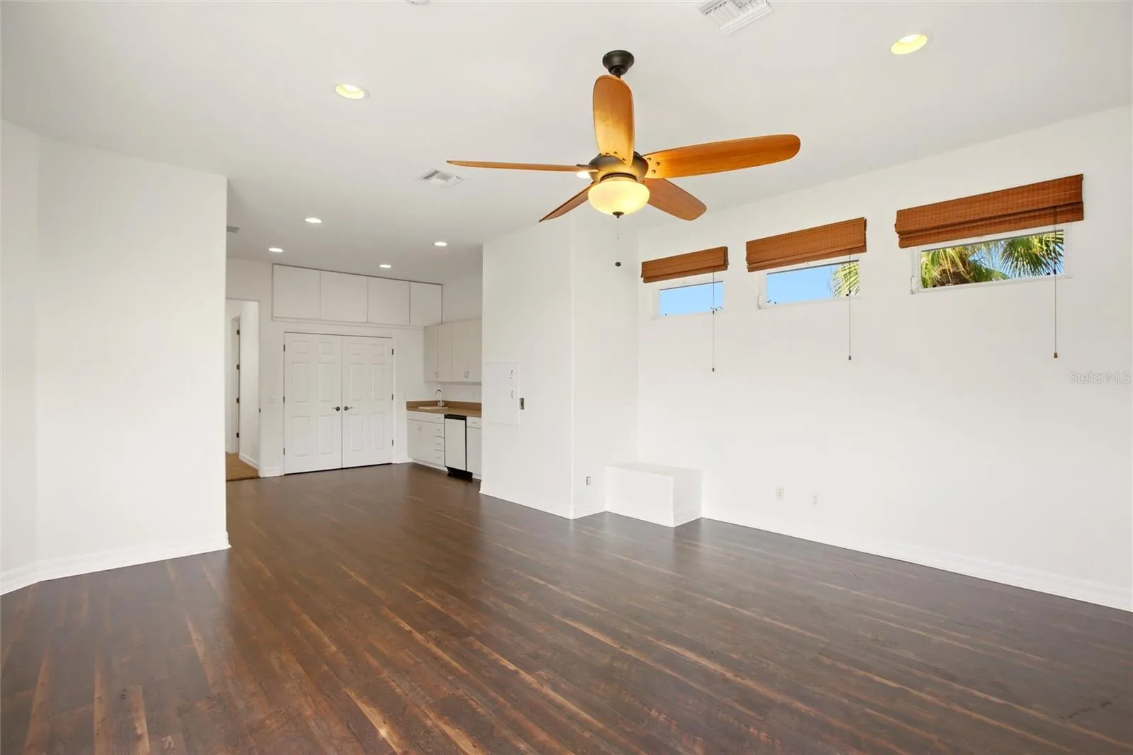The spacious bonus room offers exceptional versatility, serving as an ideal playroom, guest quarters, media room, or workout space. It is well-appointed with a wet bar, refrigerator, washer and dryer, and a large storage closet, and opens through sliding glass doors to a private second-floor balcony overlooking the lake and golf course. A dumbwaiter provides convenient access from the kitchen below.