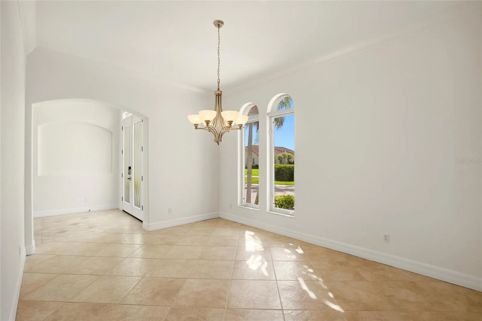 A separate dining room is conveniently located just off the kitchen and features built-in cabinetry, offering both elegance and functional storage.
