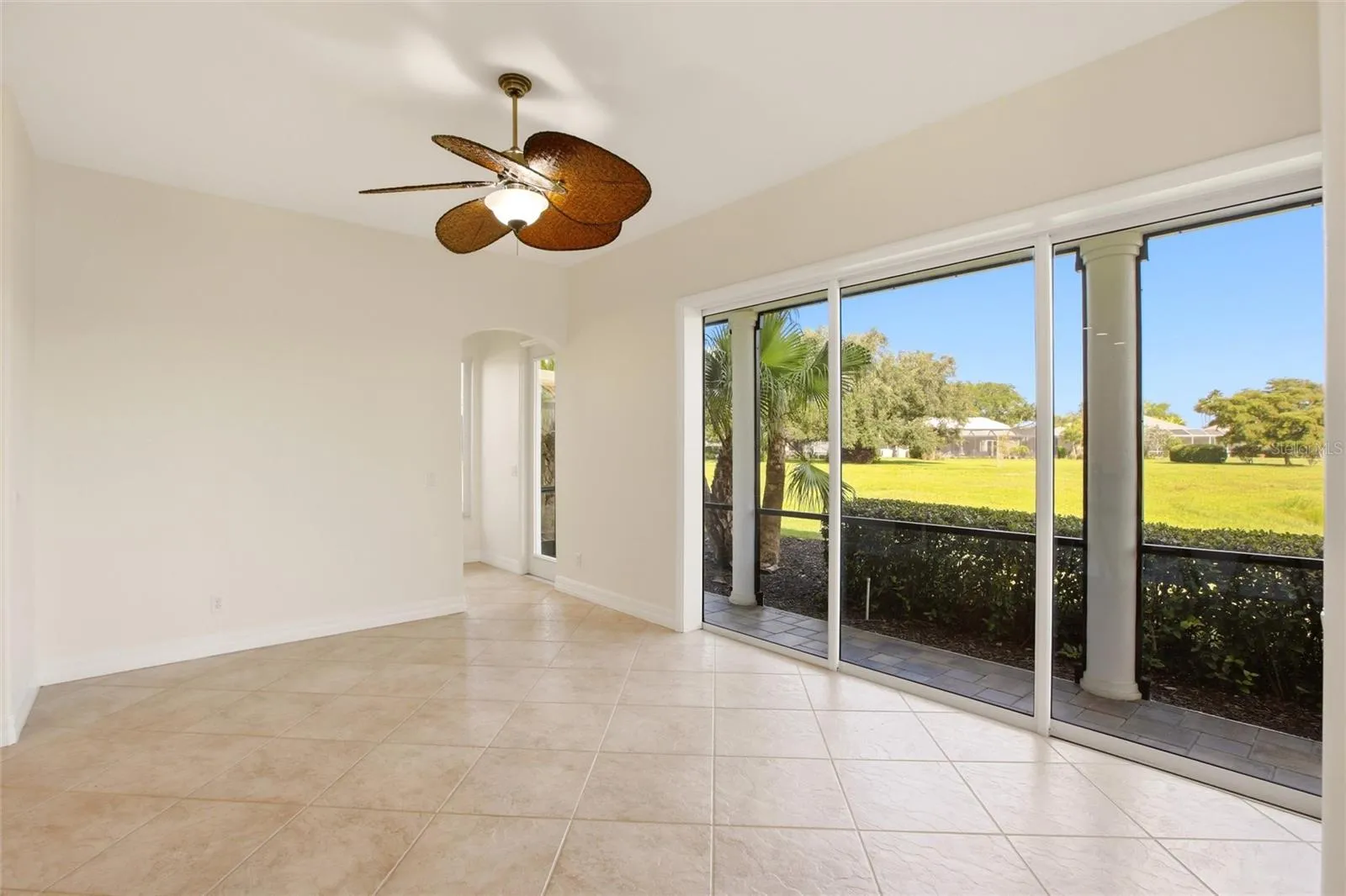 The kitchen offers an extensive breakfast bar and a comfortable casual dining area, along with generous counter space, dual sinks, double ovens, abundant cabinetry, and a spacious walk-in pantry.