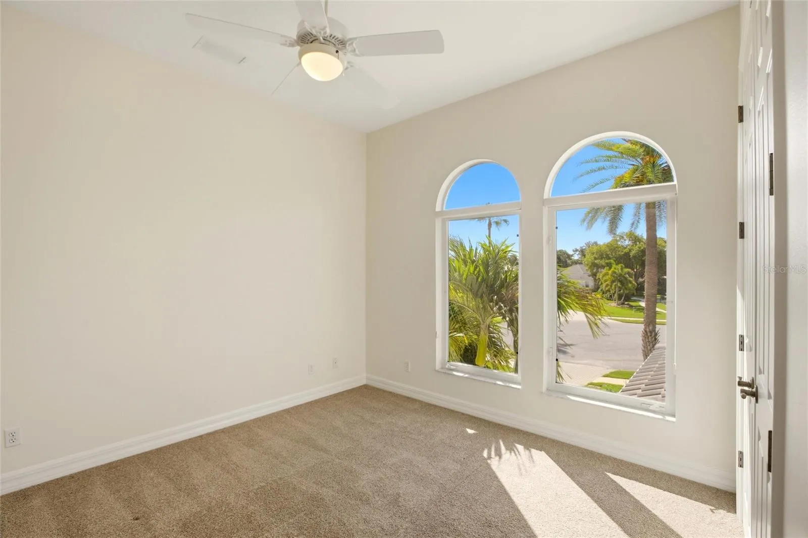 The bedroom features a built-in closet and convenient access to a nearby hall bathroom.