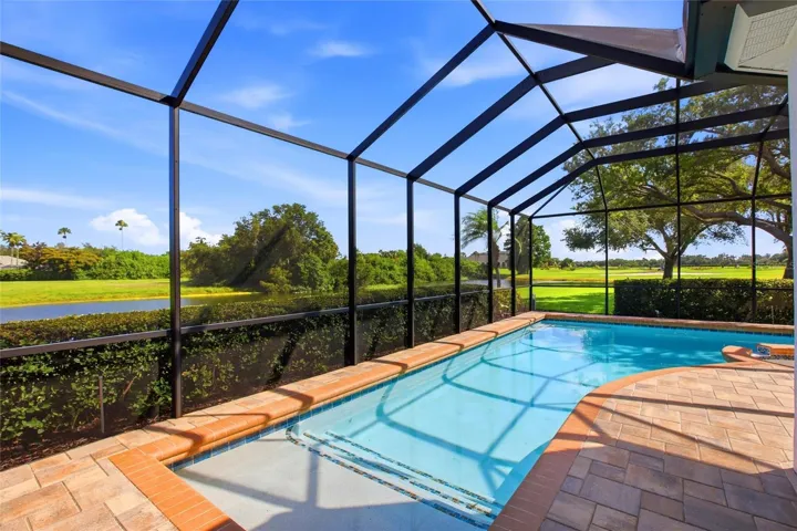 Enjoy resort-style living with a heated pool and spa overlooking the 18th hole, tranquil lake views, and the natural beauty of Misty Creek, where deer are often seen roaming the landscape.