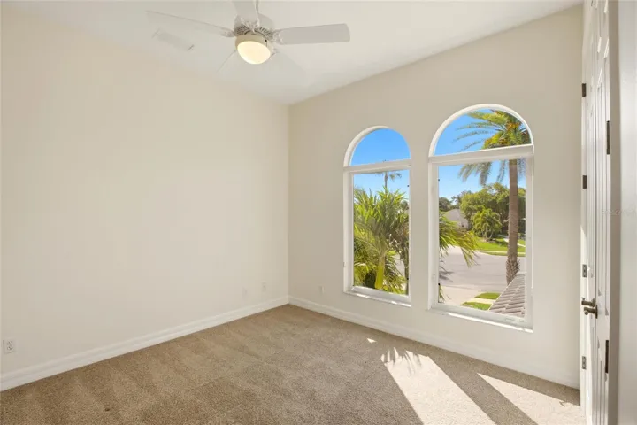 The bedroom features a built-in closet and convenient access to a nearby hall bathroom.