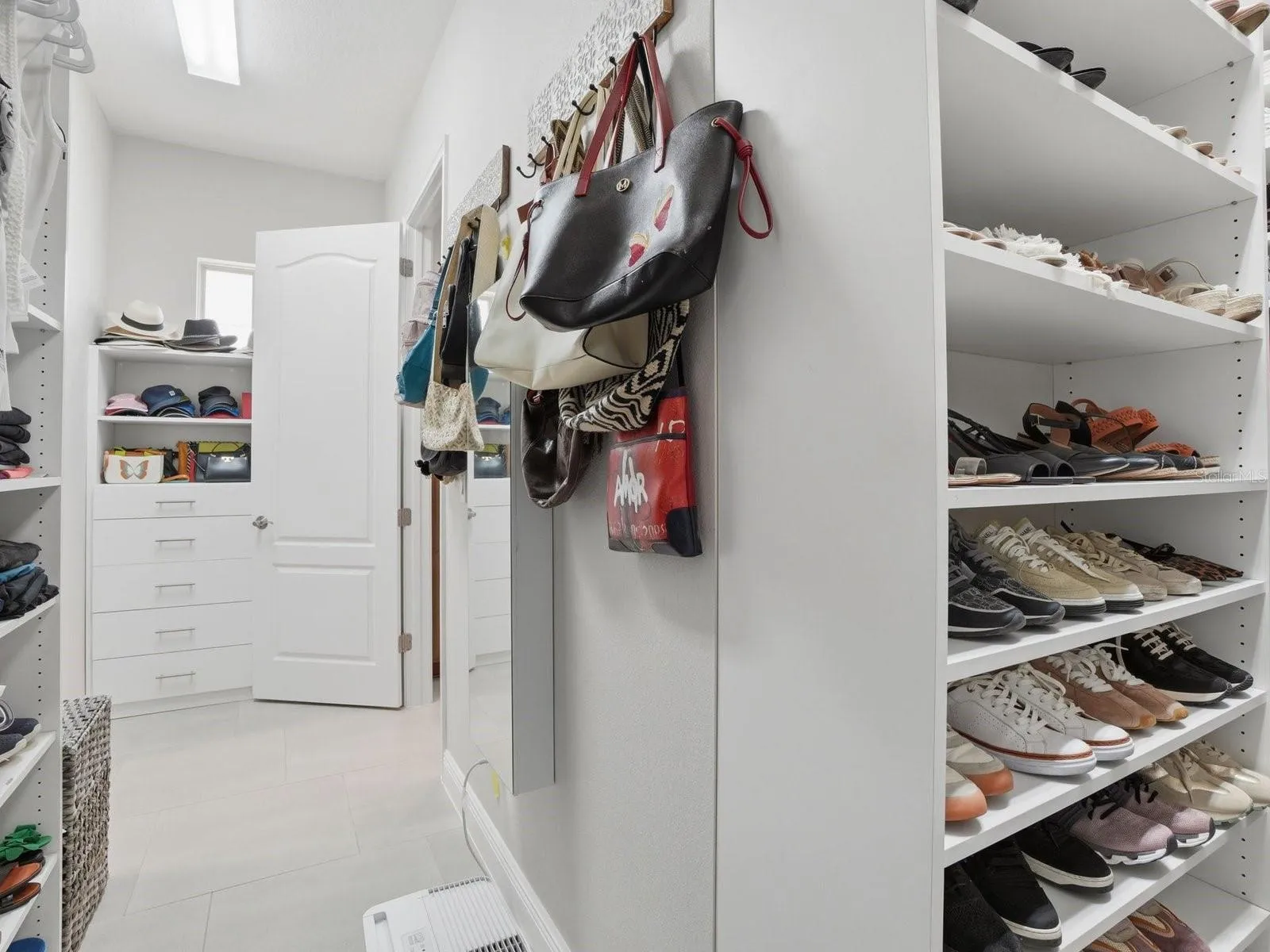 Primary Walk-in Closet off of the Bathroom