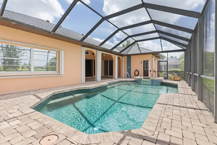 Pool and spa with accordian storm shutters