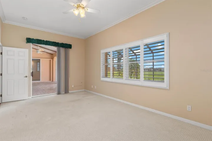Bedroom off the lanai with golf course views