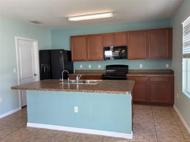 Kitchen with large island  and breakfast bar