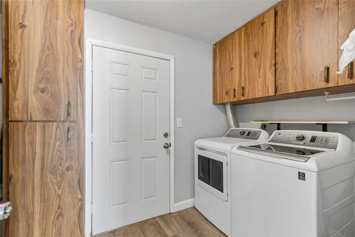Laundry Room with Exterior Access & Storage