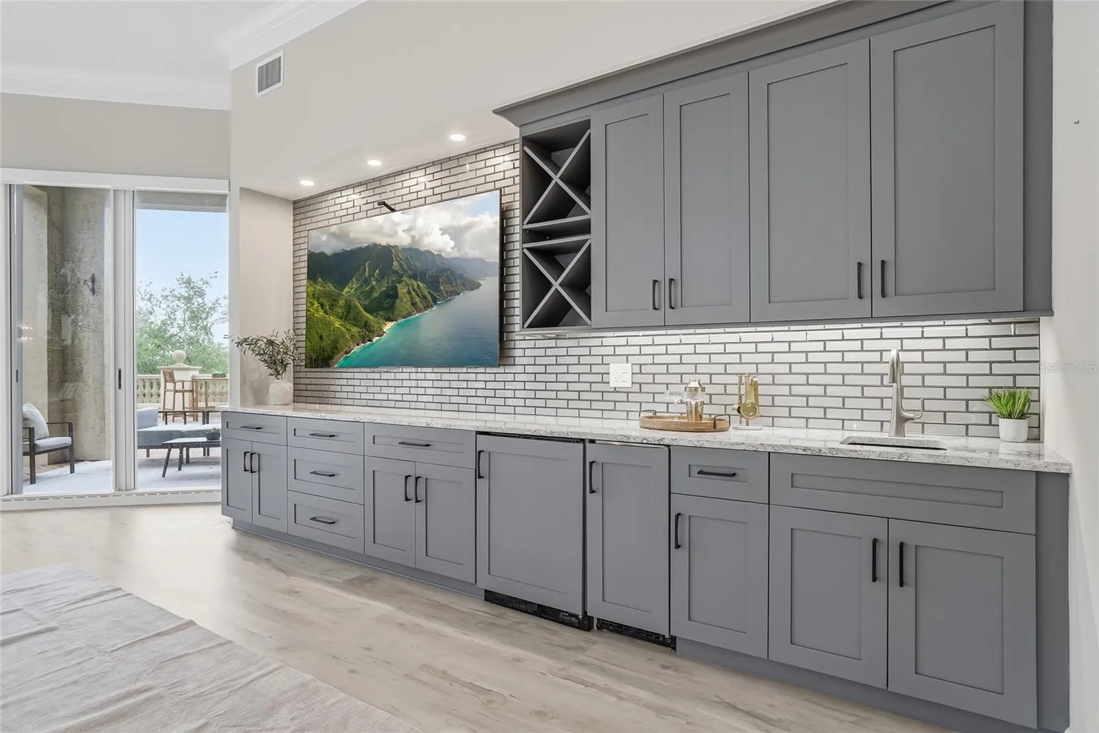 Custom media wall with wet bar, wine storage, and ice maker.