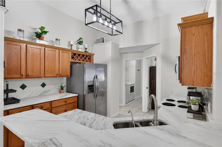 View of the entire kitchen leading to the laundry room