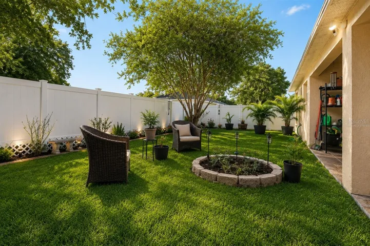 Virtually Staged Backyard with New PVC Fence