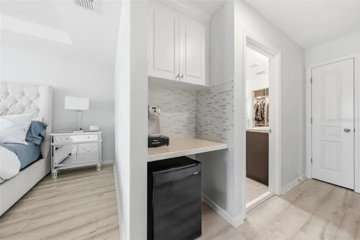 Primary Bedroom entrance with Coffee Station - Linen Closet - Double Door Closet