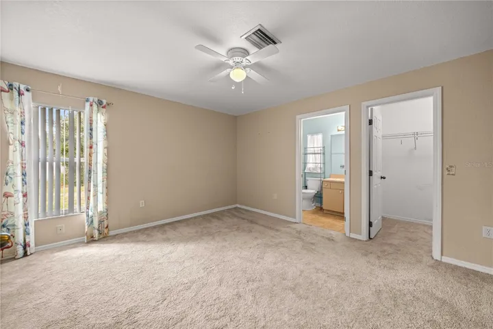 Primary Bedroom. Full bath with walk in shower. Walk in closet.