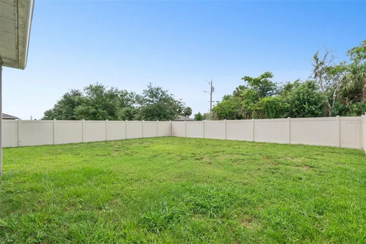 Complete fenced backyard