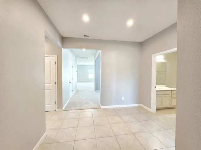 Spacious foyer with tile flooring