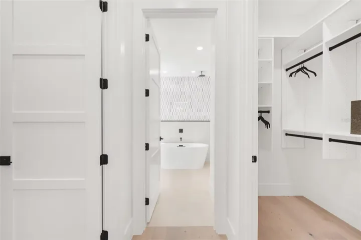 Two walk-in closets, with custom California Closet built-ins with drawers.